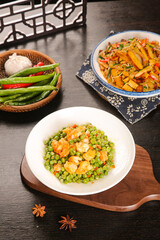 Sautéed Shrimp and Peas Asian Dish with Stir-Fried Vegetables on Wooden Table