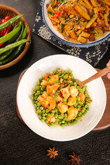 Sauteed Shrimp with Peas Asian Cuisine Meal on Wooden Table