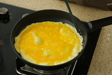 Handmade Gourmet Omelette Cooking in Pan - Kitchen Food Preparation