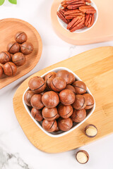 Macadamia Nuts and Pecans in Wooden Bowls Healthy Snack Food Arrangement