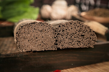 Raw Buckwheat Soba Noodles on Wooden Board Ready for Traditional Japanese Soup Preparation