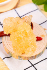 Yunnan Yellow Rock Sugar Crystals - Traditional Chinese Ancient Sweetener Pieces on Wooden Plate