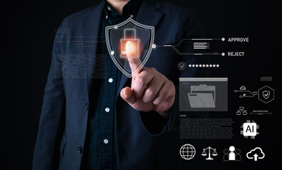 Cybersecurity concept with businessman touching virtual shield icon with lock, representing data protection, information security, access control, privacy policy, and digital file safety system.