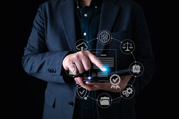 Digital ISO management concept with businessman using tablet to access certification system