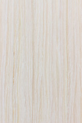 Naklejka premium texture of wood. wooden board, eclological material. artificial wooden coating, from recycled materials,beautiful texture, light, creme , view from above. vertical texture.