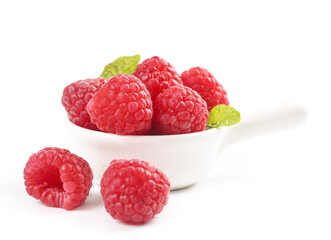 Fresh Red Raspberries in White Bowl with Mint Leaves on White Background