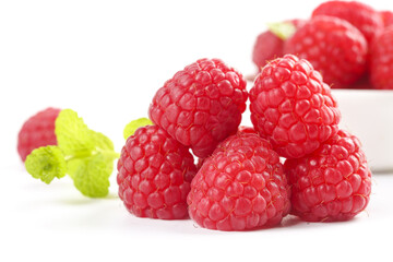 Fresh Red Raspberries with Mint Leaves Closeup on White Background - Healthy Organic Fruit