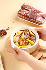 Smoked Bacon and Bamboo Shoots Stew - Traditional Asian Meat Dish with Salted Pork Belly in Ceramic Bowl