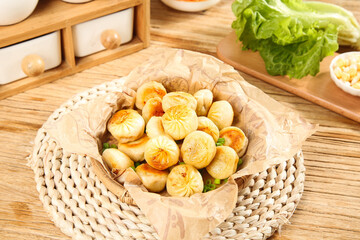Golden Pan-Fried Dumplings Breakfast Served on Wooden Table with Fresh Vegetables