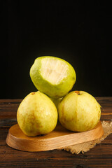Fresh Guava Fruits with Creamy Soft Center on Wooden Board - Tropical Produce Still Life