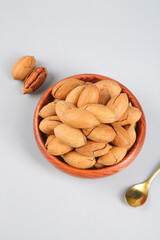 Fresh Pecans in Wooden Bowl Studio Shot - Healthy Nuts Snack for Delicious Nutrition and Longevity Benefits