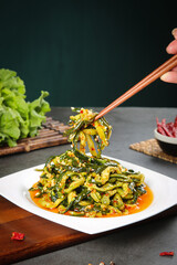 Spicy Dried Cucumber Salad with Garlic - Traditional Asian Pickled Vegetable Dish Served with Chopsticks