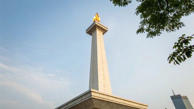 Low Angle View of National Monument Monas in Jakarta with Golden Flame Under Blue Sky