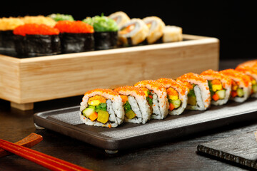 Exquisite Japanese Sushi Rolls Display on Wooden Platter - Asian Cuisine Comfort Food