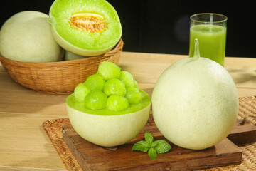 Fresh Honeydew Melon Balls with Juice on Wooden Board - Healthy Summer Fruit Display