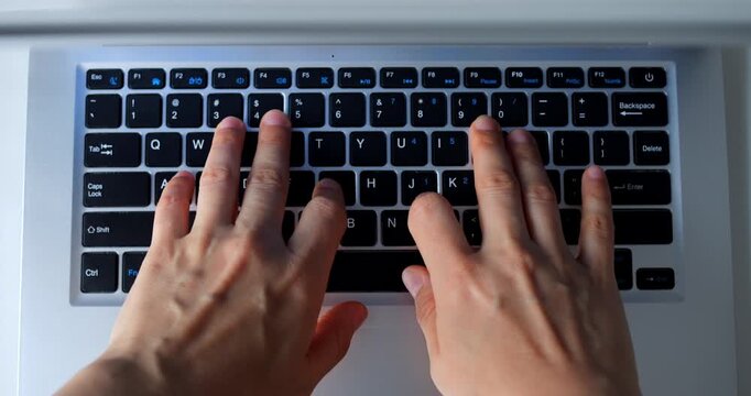 Close up of programmer hands typing code on a laptop keyboard, shown in a sequence of multiple shots, ideal for concepts related to programming, software development, and technology