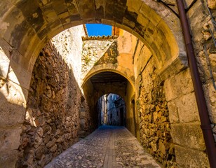 Obraz premium Ancient stone alleyway arches