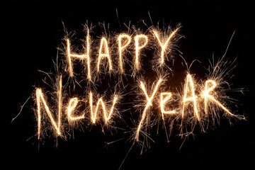 Happy New Year written in bright sparkly lights against a black background