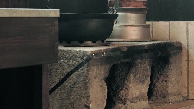 Kamado Hearth Installed in the Kitchen of a Folk House.An Irori Pot and a Hagama Rice Cooker Are Placed on Top  |  Japan