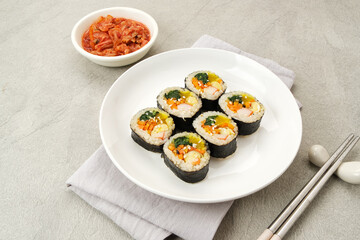 Korean Rolled Gimbap, made of rice, cucumber, tuna, carrot, sausage, crab stick and wrapped with seaweed laver. 
