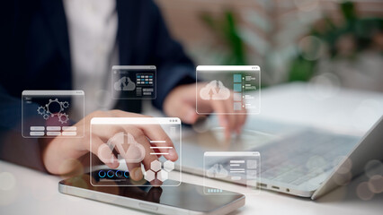 Cloud technology and data storage concept with businessman using laptop and smartphone, digital cloud computing icons representing networking, online service, internet connection, 