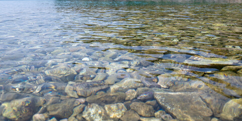 View from above of stones in clear water