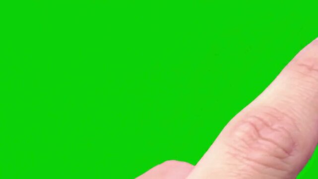 Closeup of a human finger pointing upwards against a vibrant green background