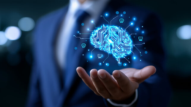 Businessman holding a glowing digital brain hologram representing artificial intelligence and innovation.
