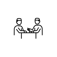 Two people arm wrestling on table