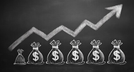 Chalkboard drawing of a rising line graph with money bags, depicting financial growth