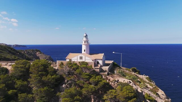Aerial Drone Circling Shot of Capdepera Lighthouse and Rugged Mediterranean Coastline, Mallorca, Spain.