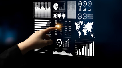 A person interacts with a sleek digital touchscreen displaying various charts and graphs, highlighting business and technology insights in a modern environment. Impute