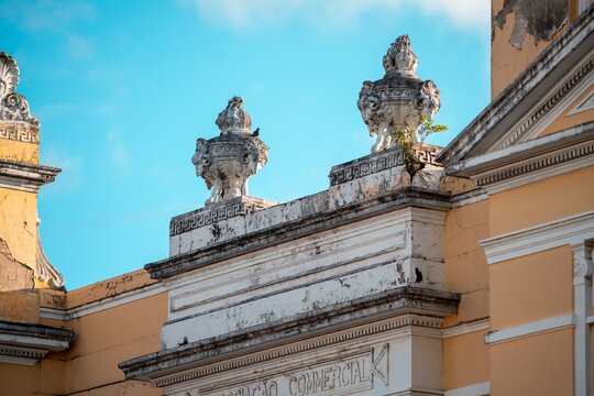 Detail of an ornate architectural facade with classical sculptures in Paraiba, Brazil