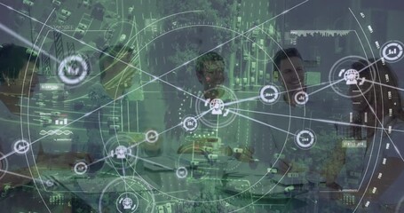 Animation of connected icons, aerial view of vehicles on road over diverse partners shaking hands - Powered by Adobe