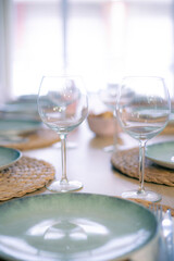 Empty wineglasses on a beautiful cutlery interior restaurant nobody on the frame close up still