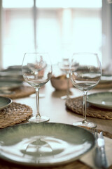 Empty wineglasses on a beautiful cutlery interior restaurant nobody on the frame close up still