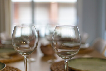 Empty wineglasses on a beautiful cutlery interior restaurant nobody on the frame close up still