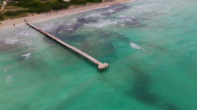 Aerial Circling Drone Shot of Moll de Fusta Pier and Turquoise Mediterranean Sea, Mallorca, Balearic Islands, Spain.