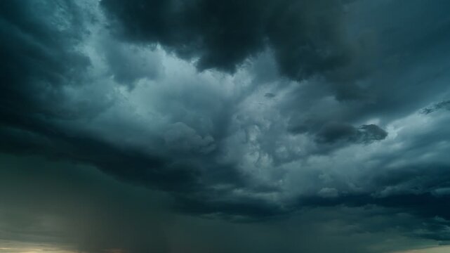 A powerful thunderstorm front. Dark storm clouds are gathering in the sky. Timelapse of thunderclouds.