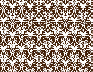 A brown and white symmetrical pattern with stylized floral and scrollwork motifs.