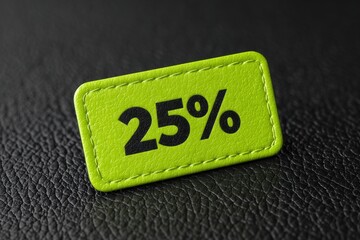 A vibrant green tag with the text 25 percent prominently displayed in black, rests on a dark leather-like surface, highlighting a discount offer.