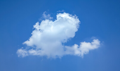 A neat cloud swirls in pairs. A lump of cottony rain in the weather forecast. An approaching thunderstorm stirs its vapors invitingly. Tall cumulus clouds. Bright hills shining.