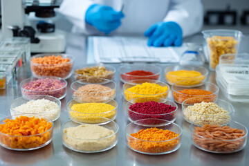 Food scientist testing various food ingredients in a lab samples in petri dishes