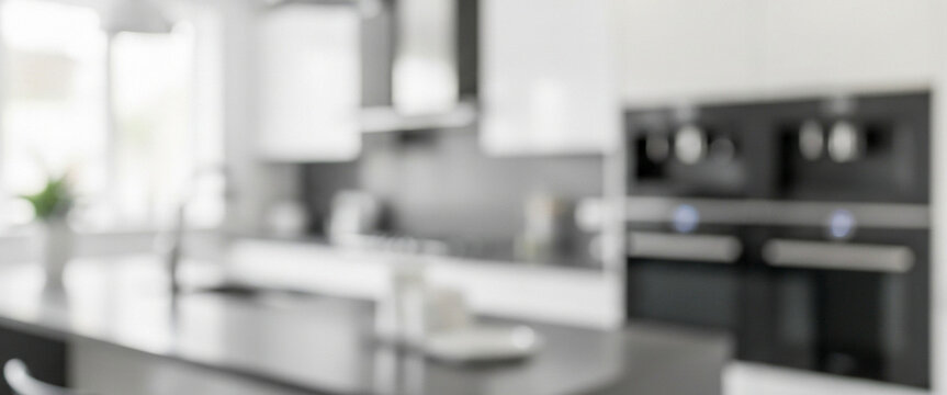 Blurred kitchen interior with island, cabinets, and appliances in a modern style, reflecting bright light, minimalistic design, and a functional domestic atmosphere.