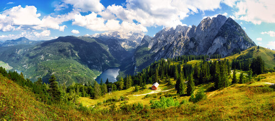 Gosausee lake in Austria Alps mountains. Austria alpine landscape in summer near Dachstein mountain range. Scenic waterfront and natural surroundings popular tourist destination in Austria Gosau See