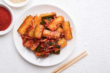 Top view of Korean kimchi cucumber on white background, Korean side dish, Homemade food