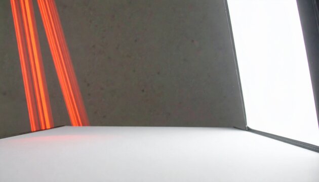 A curved red laser beam arcs elegantly from the bottom left to the top right, creating a slight reflection and glow. The beam is centered in the frame, with a black-to-transparent gradient background 