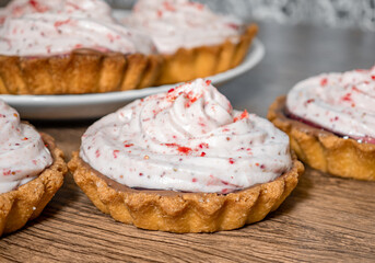 Buttery shortbread cupcakes with raspberry cream topped with freeze-dried raspberries