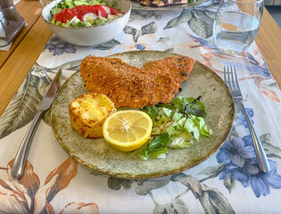 Fried chicken breast garnished with sesame seeds