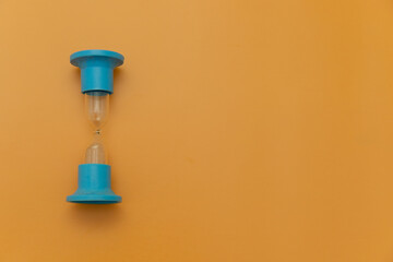 Two Minute Hourglass on orange Background